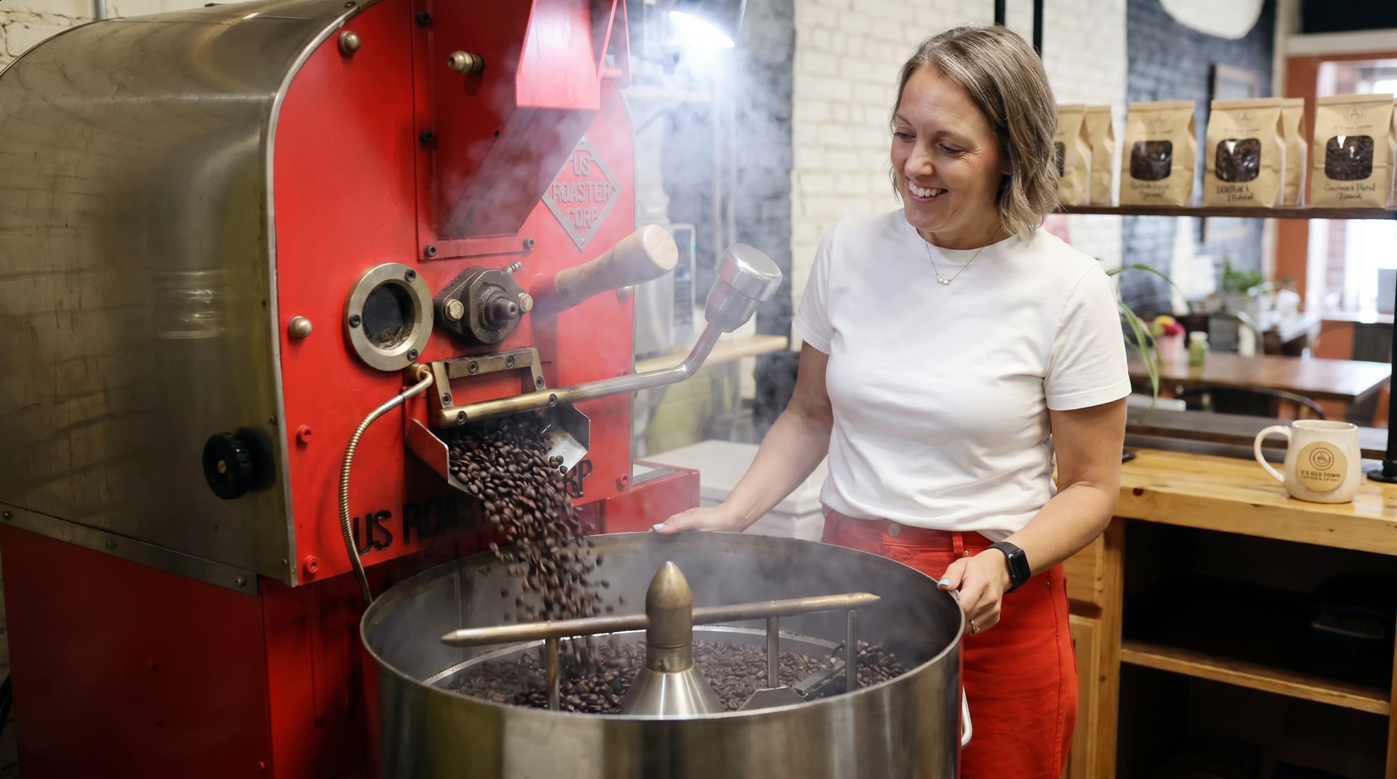 Fresh beans pouring from the roaster